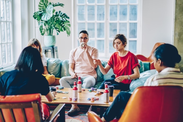 Group of friends playing a game at a board game cafe